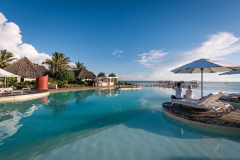 Outdoor pool, pool umbrellas, sun loungers