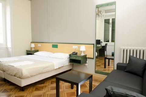 Quadruple Room | Living area | 22-inch LCD TV with digital channels, TV