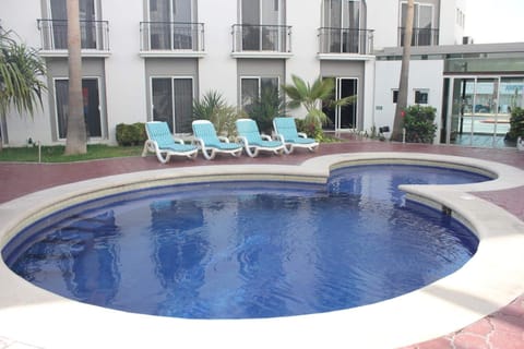 Outdoor pool, open 9:00 AM to 9:00 PM, sun loungers