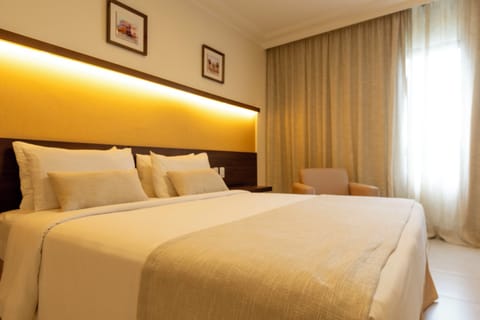 Superior Double Room | Minibar, in-room safe, desk, blackout drapes