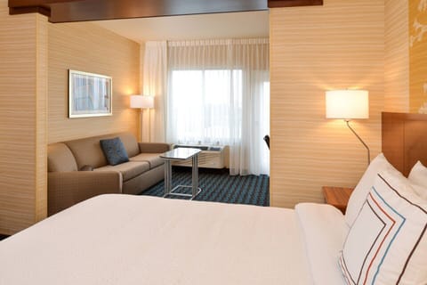 Premium bedding, desk, laptop workspace, blackout drapes