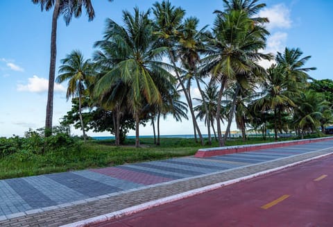 Beach nearby, white sand, beach towels