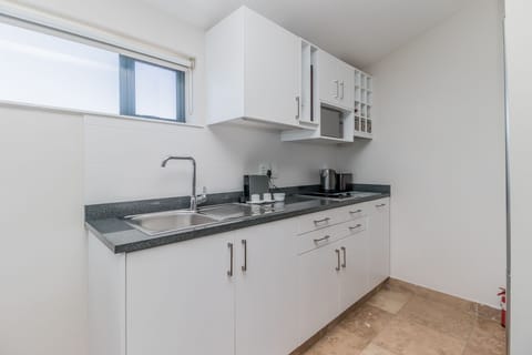 Deluxe Suite | Private kitchenette | Full-size fridge, microwave, stovetop, espresso maker