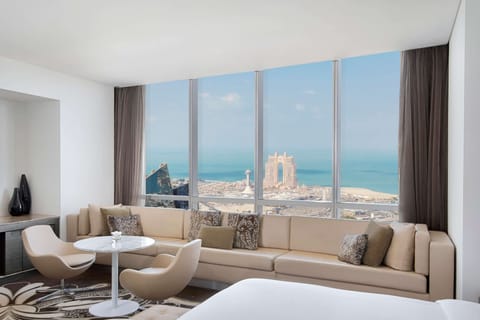 King Junior Suite With Sea View | Living area | 42-cm LED TV with premium channels, TV, iPod dock