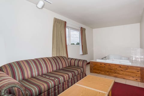 Suite, 1 King Bed | Iron/ironing board, free cribs/infant beds, rollaway beds, free WiFi
