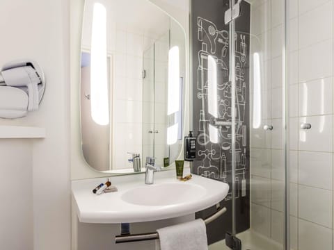 Shower, eco-friendly toiletries, hair dryer, towels