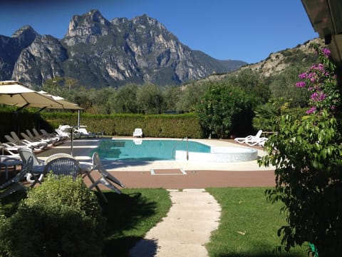 Seasonal outdoor pool, open 8:30 AM to 6:30 PM, pool umbrellas