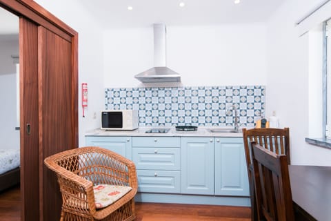 Family Suite, Garden View (with Kitchnette) | Private kitchenette | Fridge, highchair