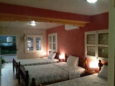 Family Triple Room, Multiple Beds, Smoking, Private Bathroom | Down comforters, minibar, in-room safe, individually decorated