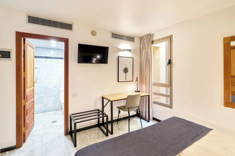 Basic Room (Torre del Conde) | Minibar, desk, blackout drapes, iron/ironing board