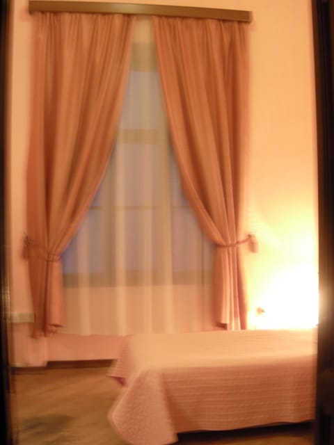 Single Room, Shared Bathroom | Down comforters, desk, blackout drapes, iron/ironing board