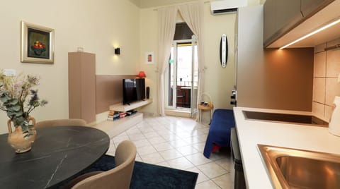 City Apartment, 1 Bedroom, Balcony | Living area | 82-cm flat-screen TV with cable channels, TV