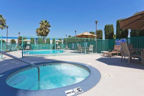 Outdoor pool, open 9 AM to 11 PM, sun loungers