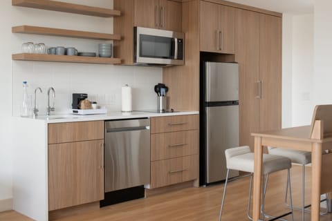 Studio, 1 King Bed with Sofa bed | Private kitchen | Full-size fridge, microwave, coffee/tea maker, cookware/dishes/utensils