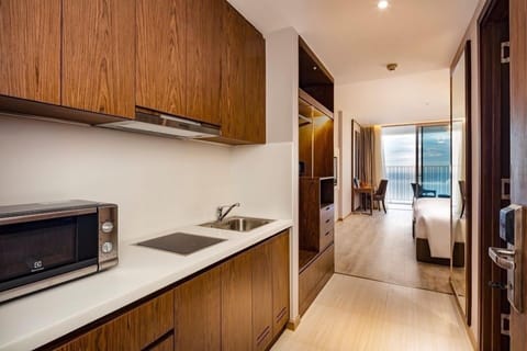 Deluxe Suite, Multiple Beds, Ocean View, Beachfront | Private kitchen | Fridge, microwave, electric kettle, paper towels