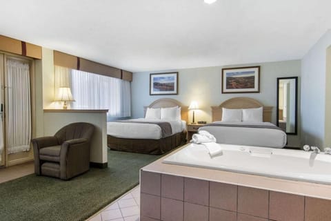 Jacuzzi Suite, Two Queen Beds | Premium bedding, desk, iron/ironing board, free WiFi