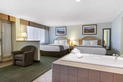 Jacuzzi Suite, Two Queen Beds | Premium bedding, desk, iron/ironing board, free WiFi