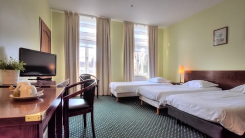 Standard Triple Room | Pillowtop beds, desk, laptop workspace, blackout drapes