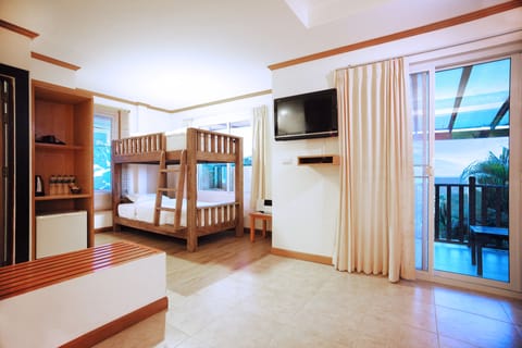 Family Room | 1 bedroom, minibar, in-room safe, individually decorated