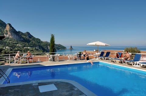 Seasonal outdoor pool, open 9:00 AM to midnight, pool umbrellas