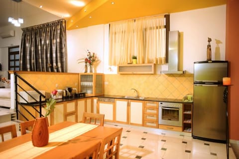 Deluxe Apartment, 2 Bedrooms | Private kitchen | Fridge, microwave, coffee/tea maker, electric kettle