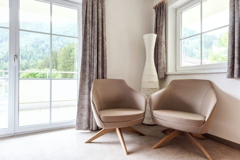 Premium Condo | Living area | 70-cm flat-screen TV with cable channels, LED TV, video-game console