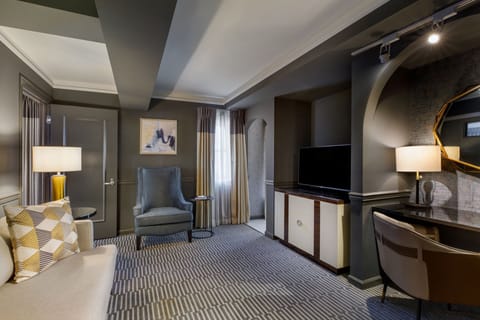 Suite, 1 King Bed | Living room | 42-inch flat-screen TV with cable channels, TV, iPod dock