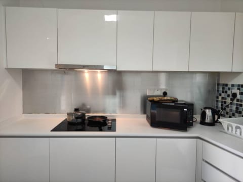 Apartment, 1 Bedroom | Private kitchen | Electric kettle, dining tables