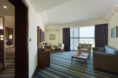 Executive Suite, Partial Sea View | Egyptian cotton sheets, premium bedding, memory foam beds, minibar