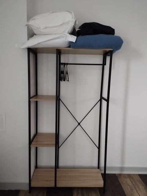 Desk, iron/ironing board, bed sheets