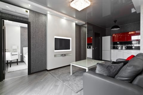 Deluxe Apartment | Living area | 40-inch flat-screen TV with cable channels, TV, Netflix