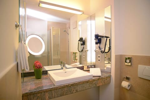 Shower, eco-friendly toiletries, hair dryer, towels