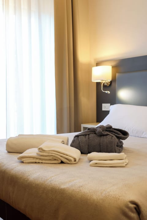 Premium bedding, down comforters, pillowtop beds, minibar