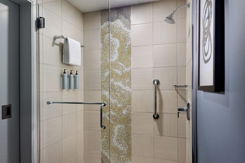 Combined shower/tub, designer toiletries, hair dryer, towels