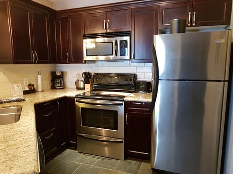 Family Condo, 2 Bedrooms, Accessible, Balcony | Private kitchen | Full-size fridge, microwave, oven, stovetop