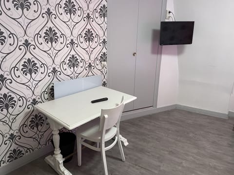 Quadruple Room | Living area | 40-cm flat-screen TV with cable channels, TV