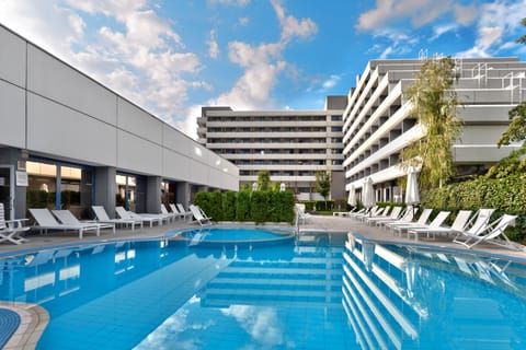 Indoor pool, outdoor pool, pool umbrellas, sun loungers