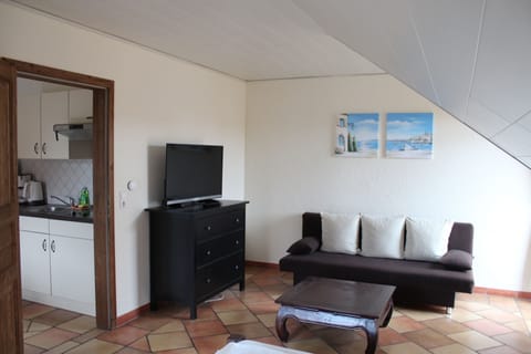 Standard Apartment, 2 Bedrooms, Balcony | Living area | Flat-screen TV