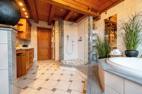 Grand Chalet | Bathroom | Rainfall showerhead, free toiletries, hair dryer, bathrobes