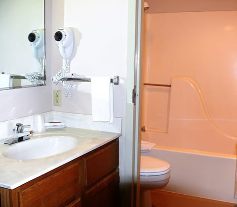 Suite, 1 King Bed, Non Smoking | Bathroom | Combined shower/tub, free toiletries, hair dryer, towels