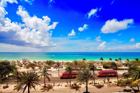 On the beach, white sand, free beach cabanas, beach umbrellas