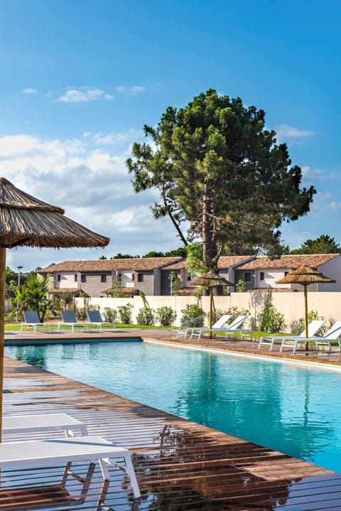 Outdoor pool, a heated pool, sun loungers