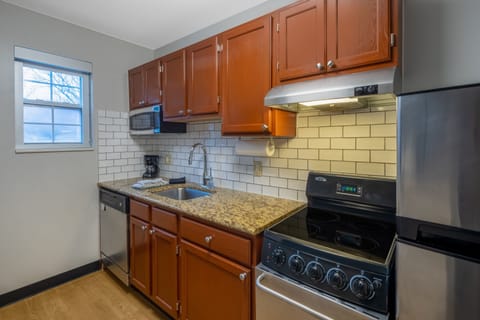 Suite, 2 Bedrooms | Private kitchen | Full-size fridge, microwave, oven, stovetop