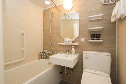 Combined shower/tub, free toiletries, hair dryer, slippers