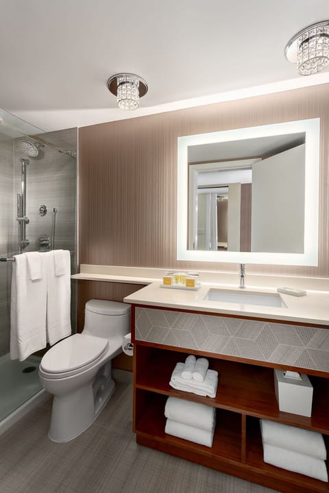 Deluxe Room, 1 King Bed | Bathroom | Shower, designer toiletries, hair dryer, bathrobes