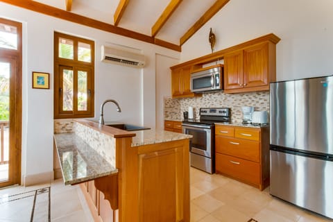 2 Bedroom Poolfront Suite | Private kitchen | Fridge, coffee/tea maker