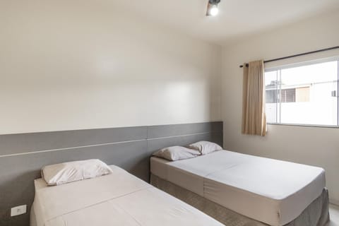 Triple Room, Multiple Beds | Minibar, desk, free WiFi, bed sheets