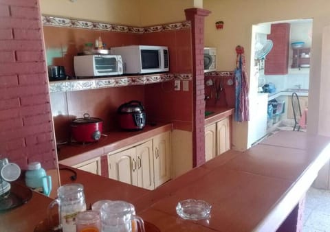 Deluxe Quadruple Room | Private kitchen | Coffee/tea maker