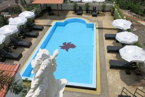 Outdoor pool, open 8:00 AM to 7:00 PM, pool umbrellas, sun loungers