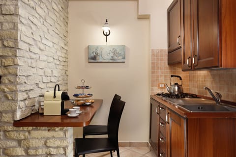 Basic Studio, Garden View | Private kitchen | Fridge, coffee/tea maker, cookware/dishes/utensils